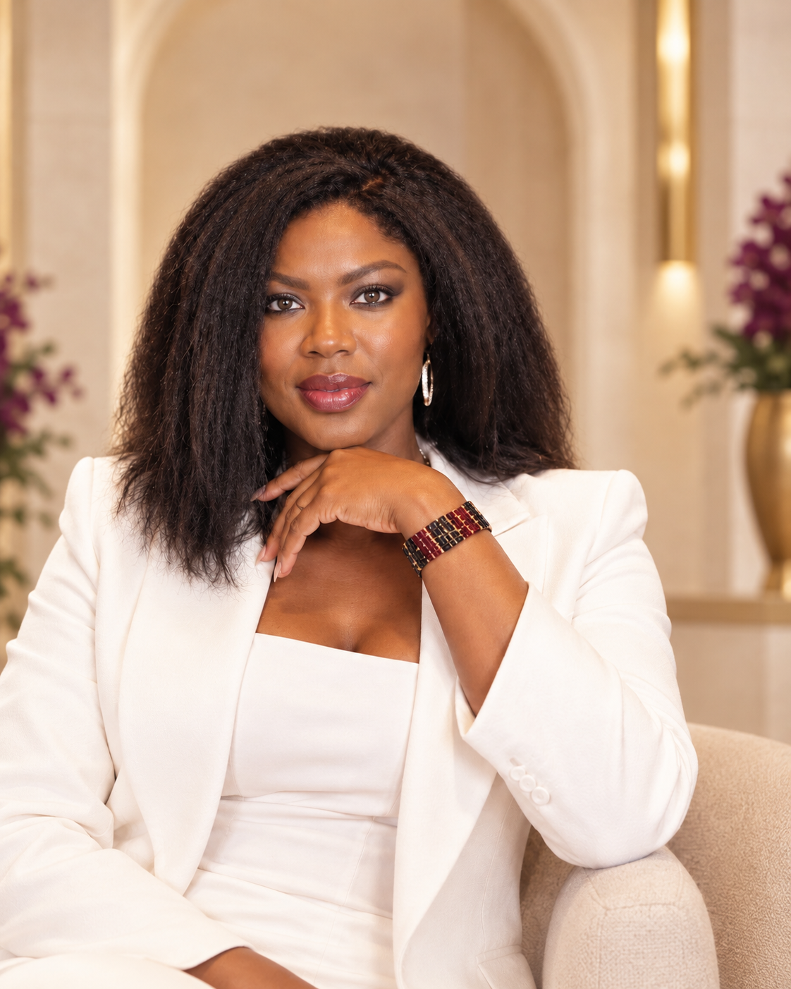 Portrait of Dr. Shelia Lambi-Oben wearing a white blazer